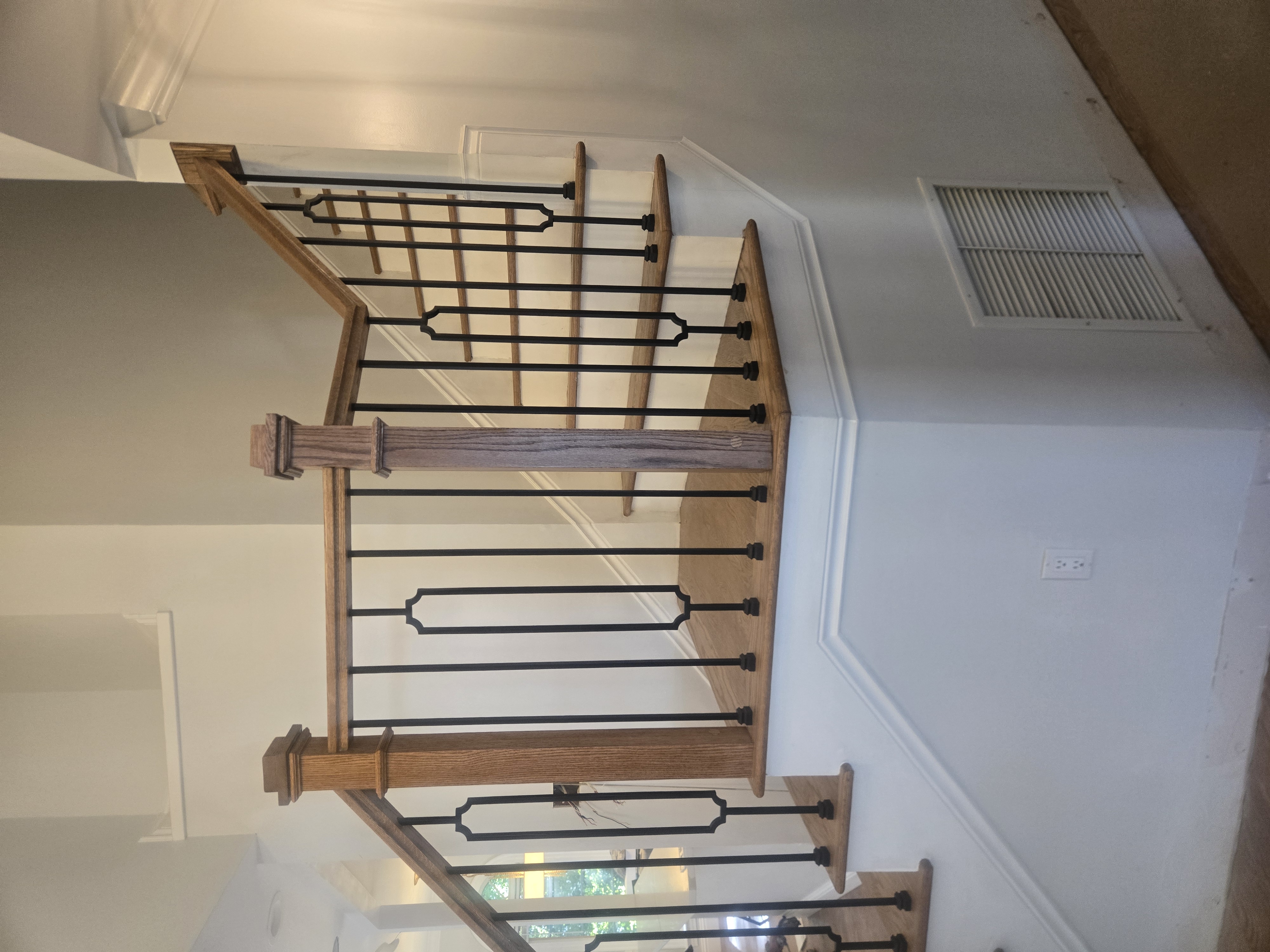 White oak staircase with iron spindles