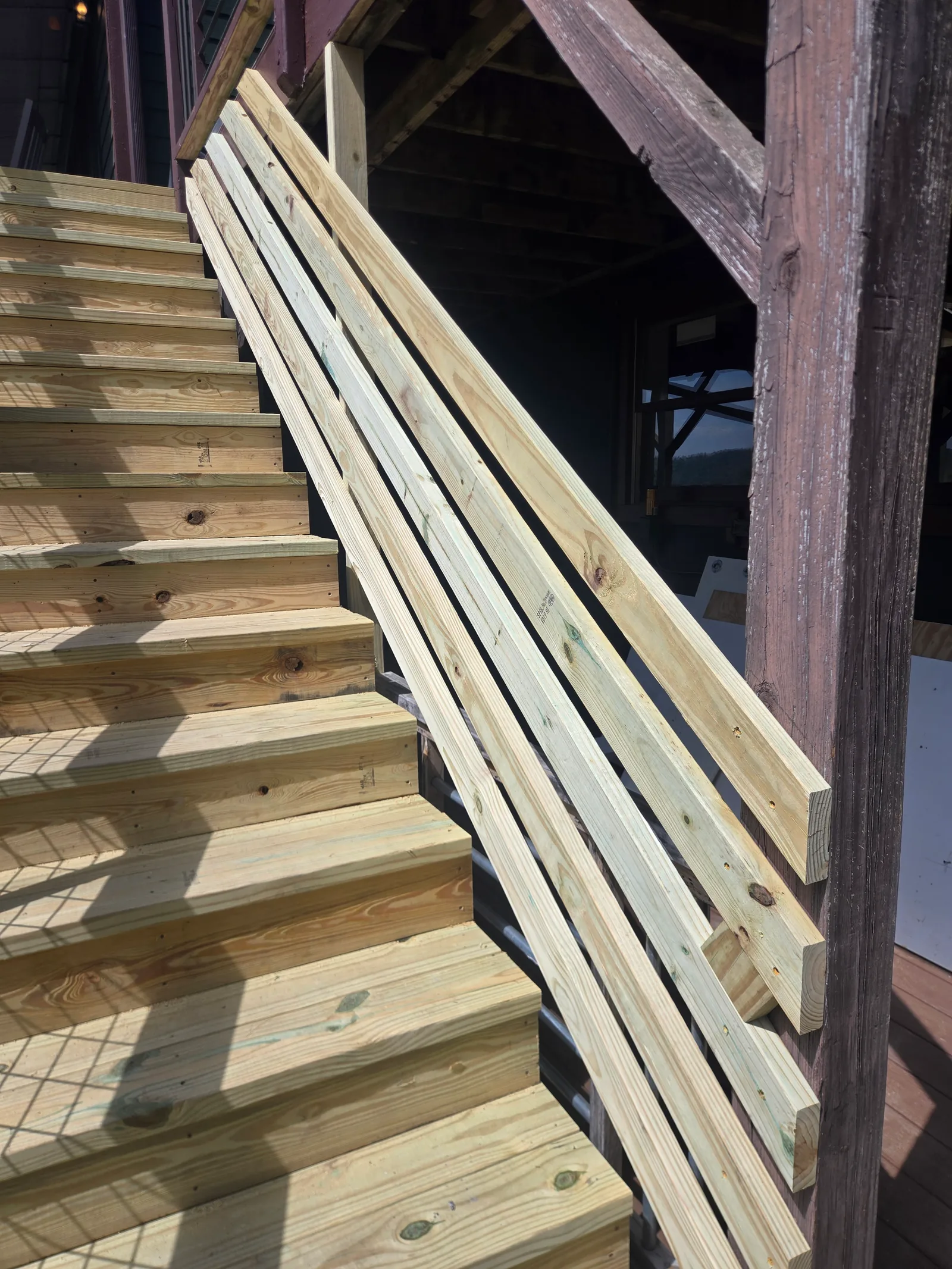 Wood handrail detail on an exterior staircase