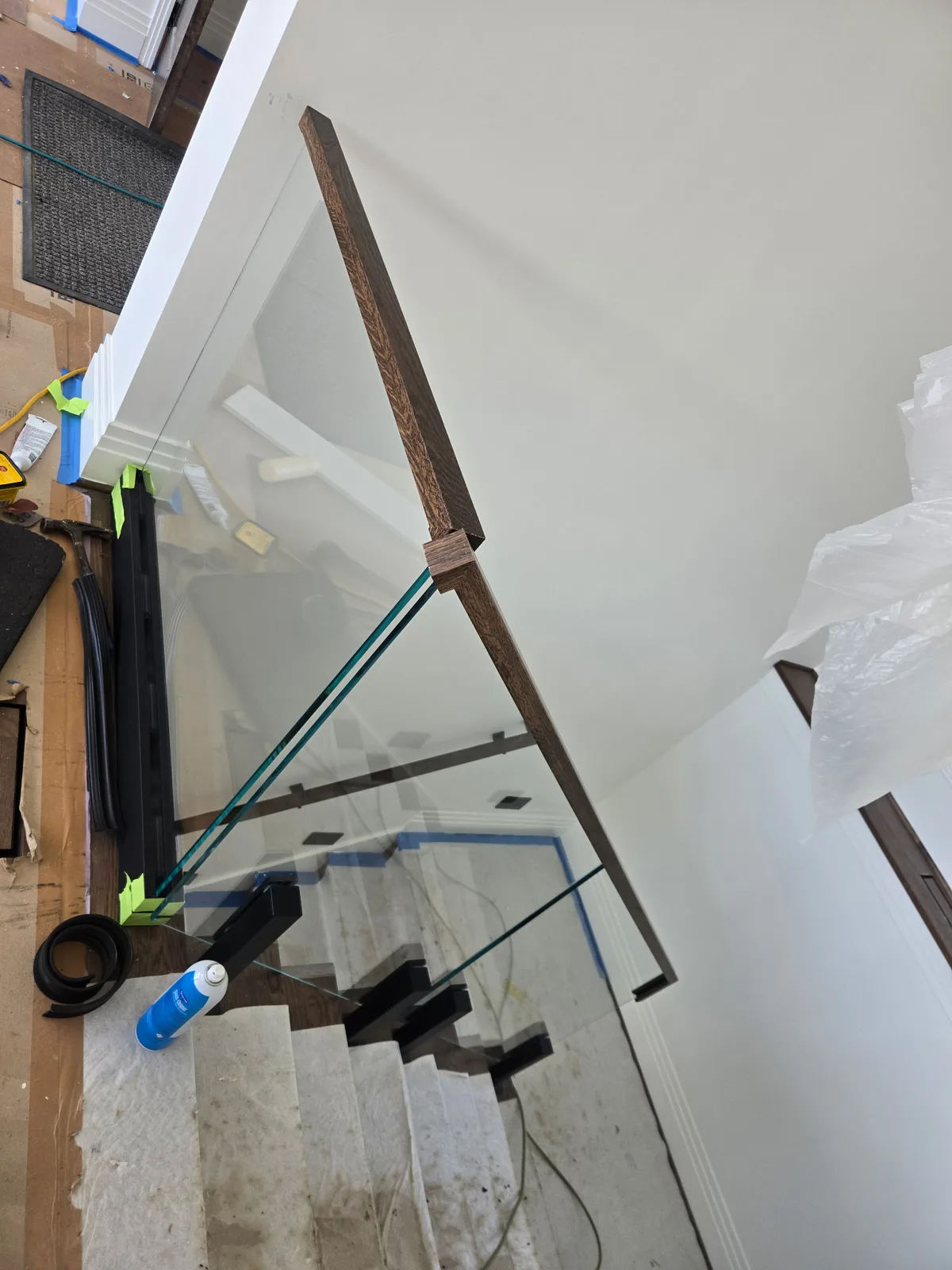 Viewrail glass railing panel and wood handrail installation